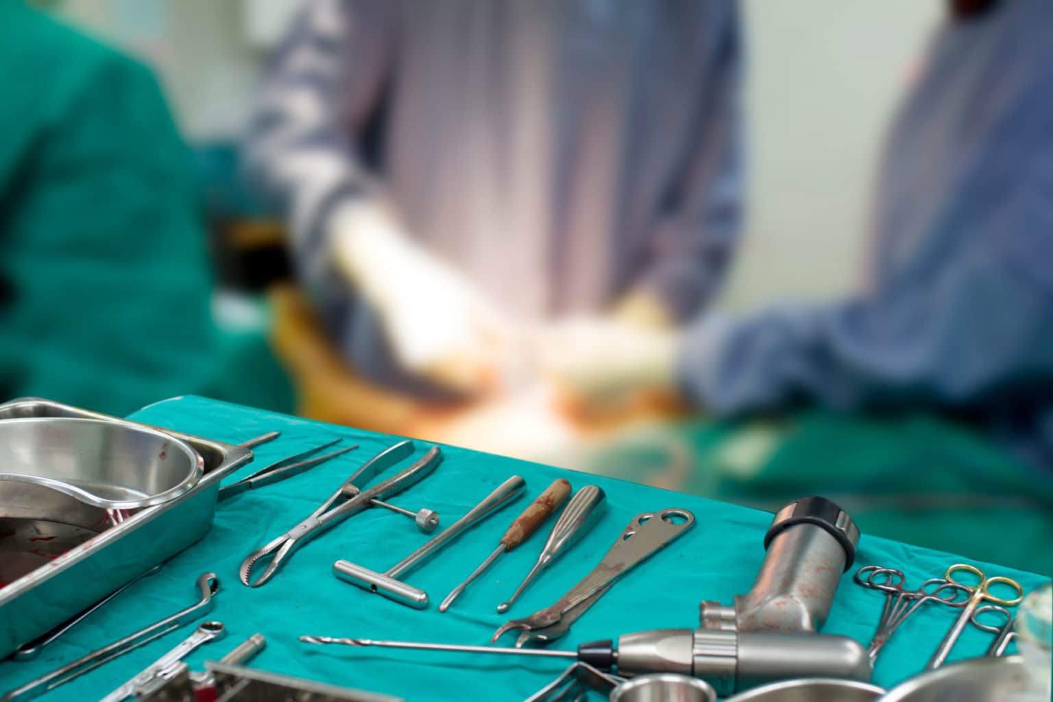 Tool, for Orthopedic surgery, On a blurred background of surgeon team.